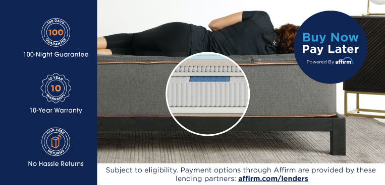 A woman laying on a Tommie Copper Mattress.