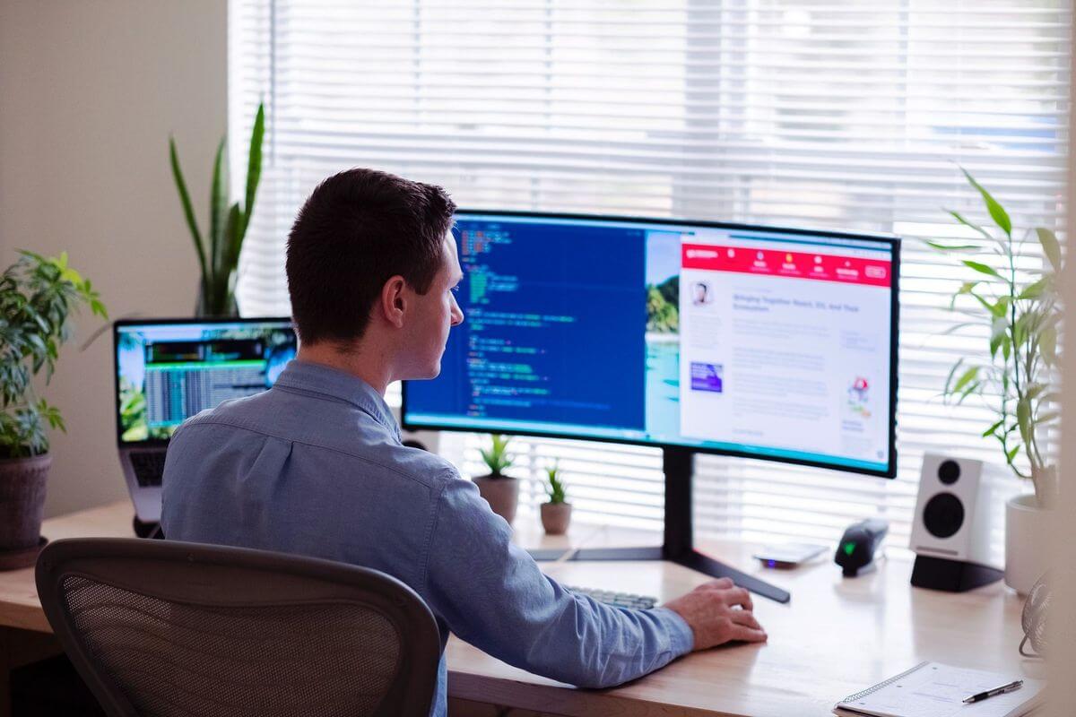 A man working on his computer at home