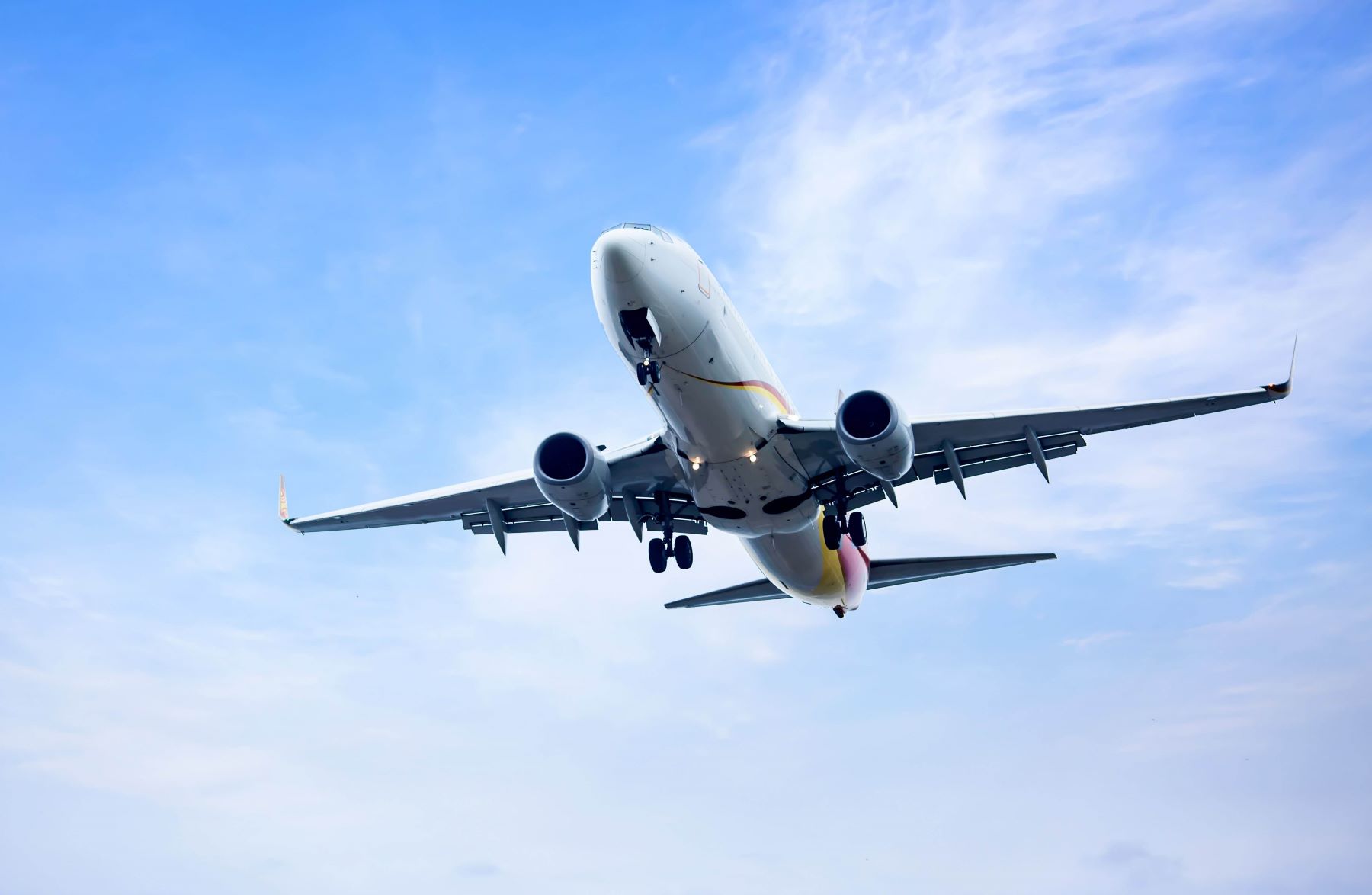 plane flying in blue sky