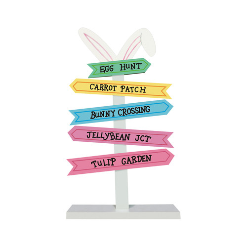 Easter themed white wood direction sign post with bunny ears and multicoloured arrow signs. Easter themed white wood direction sign post with bunny ears and multicoloured arrow signs.