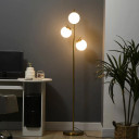 Modern Gold Floor Lamp with Three Lights in a Stylish Living Room