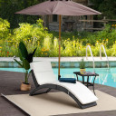 Ergonomic Rattan Sun Lounger with Cushion in Outdoor Garden Setting