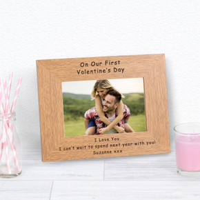 On Our First Valentine's Day Wood Picture Frame featuring a stylish oak finish, engraved with the special message. Accommodates a 6x4 photograph, available in both Portrait and Landscape orientations.