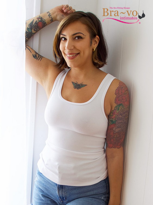 The Bra:30 Scoop in White is the definition of simple, clean comfort. Designed to slip on effortlessly, this wireless tank bra gives gentle compression and a natural shape without any hardware. The crisp white shade makes it an easy match for every wardrobe, whether worn as a layering piece, lounging staple, or your go-to end-of-day relief.