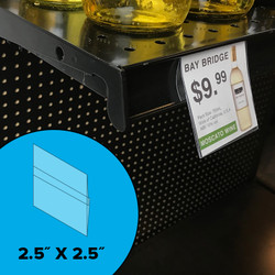 Sign holder shown with wine shelf talker attached to price tag channel. Sign holder shown with wine shelf talker attached to price tag channel.