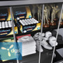 Sleek and secure sliding doors with locking system, ideal for safeguarding sports merchandise on a 4-foot-wide, 84-inch-high black gondola.