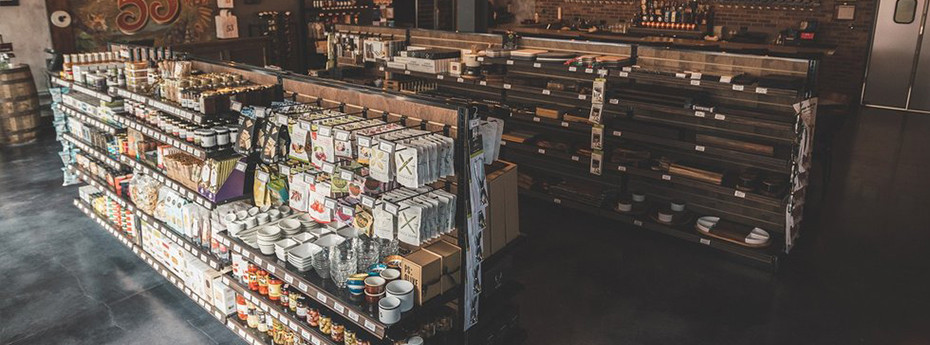 See How DGS Retail Transformed Vintage 53 with Customized Wood Stained Gondola Shelving 