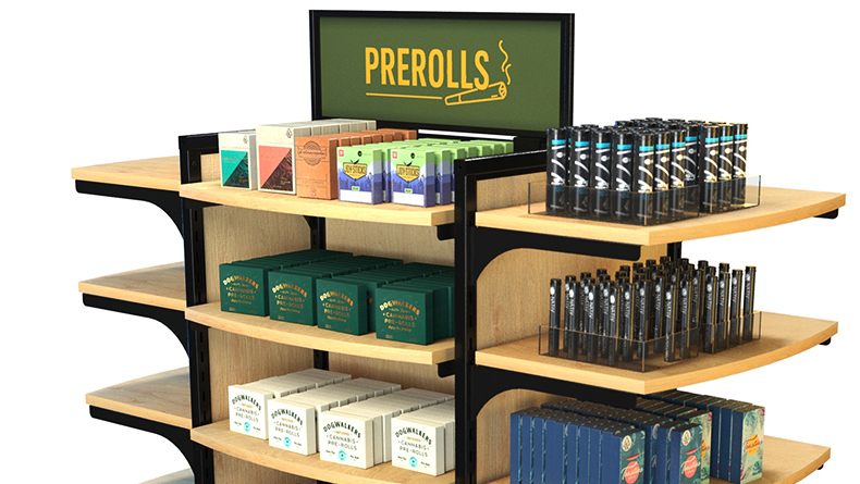 Close-up of the Premium Black & Wood Cigarette Display stocked with preroll boxes and tubes. The shelving unit features natural wood shelves with black metal framing and a green header sign labeled 'PREROLLS,' making it ideal for merchandising cannabis prerolls or small tobacco products in dispensaries and smoke shops.