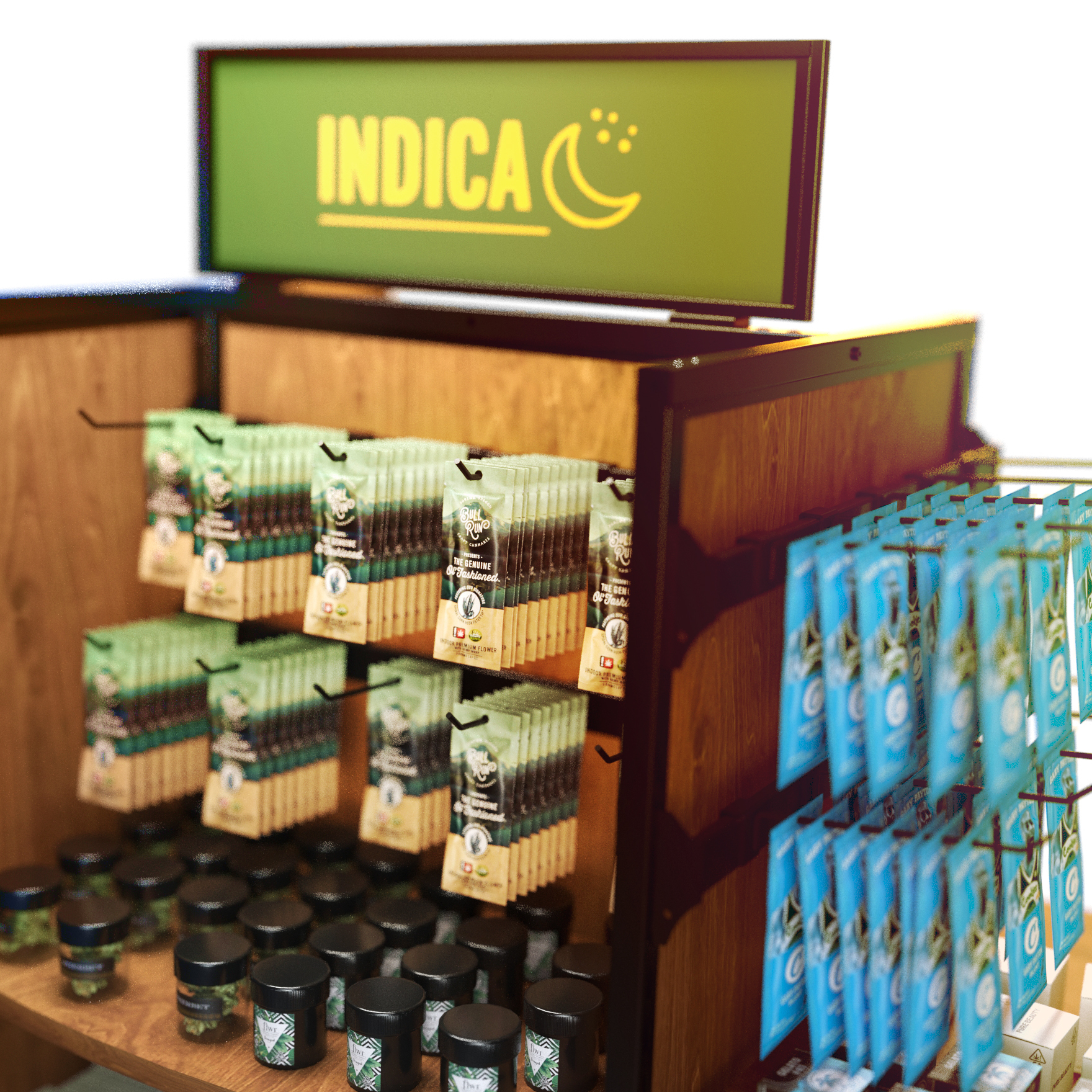 Close-up of a rolling cigarette and tobacco display rack with black metal frame and wood paneling, featuring hanging pouches of smoking products on metal peghooks and jars of cannabis flower on wood shelves. The top signage panel reads ‘Indica’ in bold yellow letters with a crescent moon icon, while the side panel displays additional hanging blue product packs. Ideal for use in dispensaries, smoke shops, and specialty retail stores.