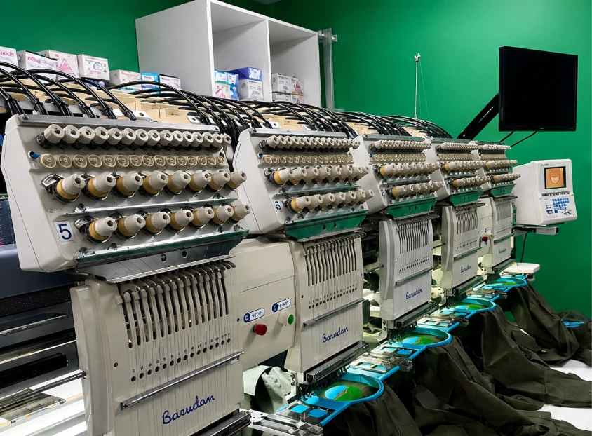 Multi-head embroidery machine stitching logos
