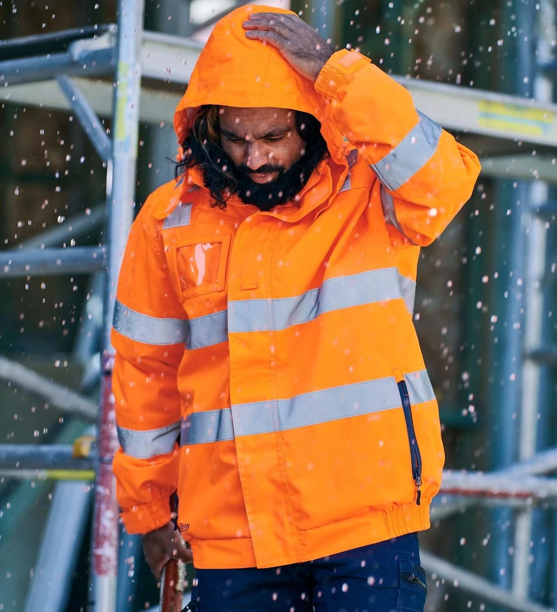 Worker in a hi-vis rain jacket