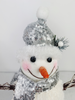 Shiny Silver Snowman Decoration Close Up