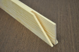 Close-up of kiln-dried pine canvas stretcher bars showing finger-spliced joints for strength and durability. The smooth, knot-free wood surface makes them ideal for large canvases and long-term stability