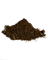 Side view mound of Italian Green Raw Umber dry pigment powder PBr7 natural umber earth from Italy