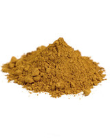 Side view mound of Italian Raw Sienna dry pigment powder transparent sienna earth pigment close-up