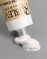 Rublev Artists Oil Paint Lead White #2 150ml tube dispensing thick ropey flake white oil paint onto a neutral background