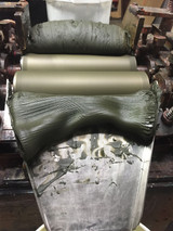 Antica Green Earth pigment paste being ground on a three-roll mill - Rublev Colours oil paint making