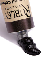 Close-up of Rublev Cassel Earth oil paint squeezed from tube showing deep brown-black colour, 50ml