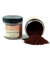 Rublev Colours pigment jar tipped with Blue Ridge Violet Hematite powder spilling out natural PR102 red iron oxide