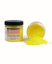 Rublev Colours Cadmium Yellow Light pigment jar on its side with yellow powder spilling out, close-up texture