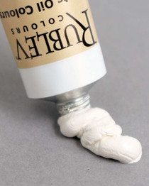 Rublev Artists Oil Paint Lead White #1 150ml tube dispensing creamy flake white oil paint onto a grey surface