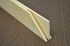 Close-up of kiln-dried pine canvas stretcher bars showing finger-spliced joints for strength and durability. The smooth, knot-free wood surface makes them ideal for large canvases and long-term stability