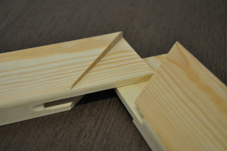 Close-up of kiln-dried pine stretcher bars with smooth, knot-free surface Close-up of kiln-dried pine stretcher bars with smooth, knot-free surface