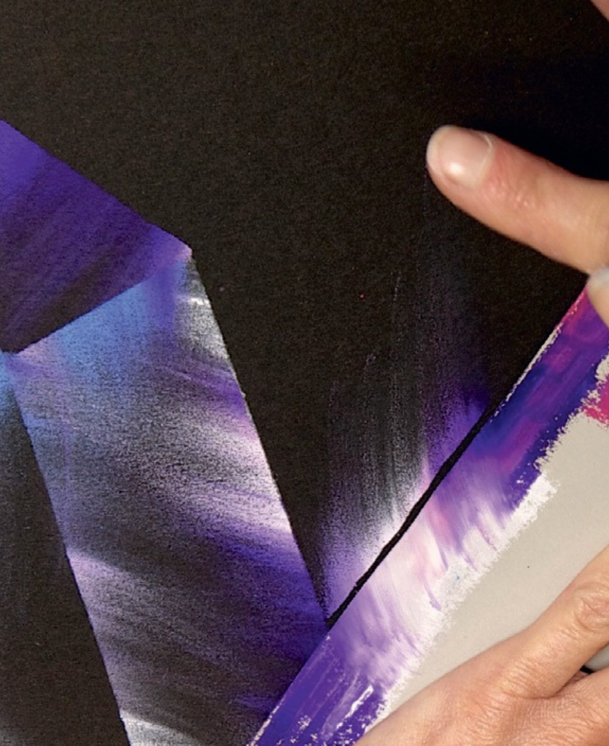 Finger blending Caran d’Ache Neopastel purple and blue oil pastels on black paper for smooth gradients