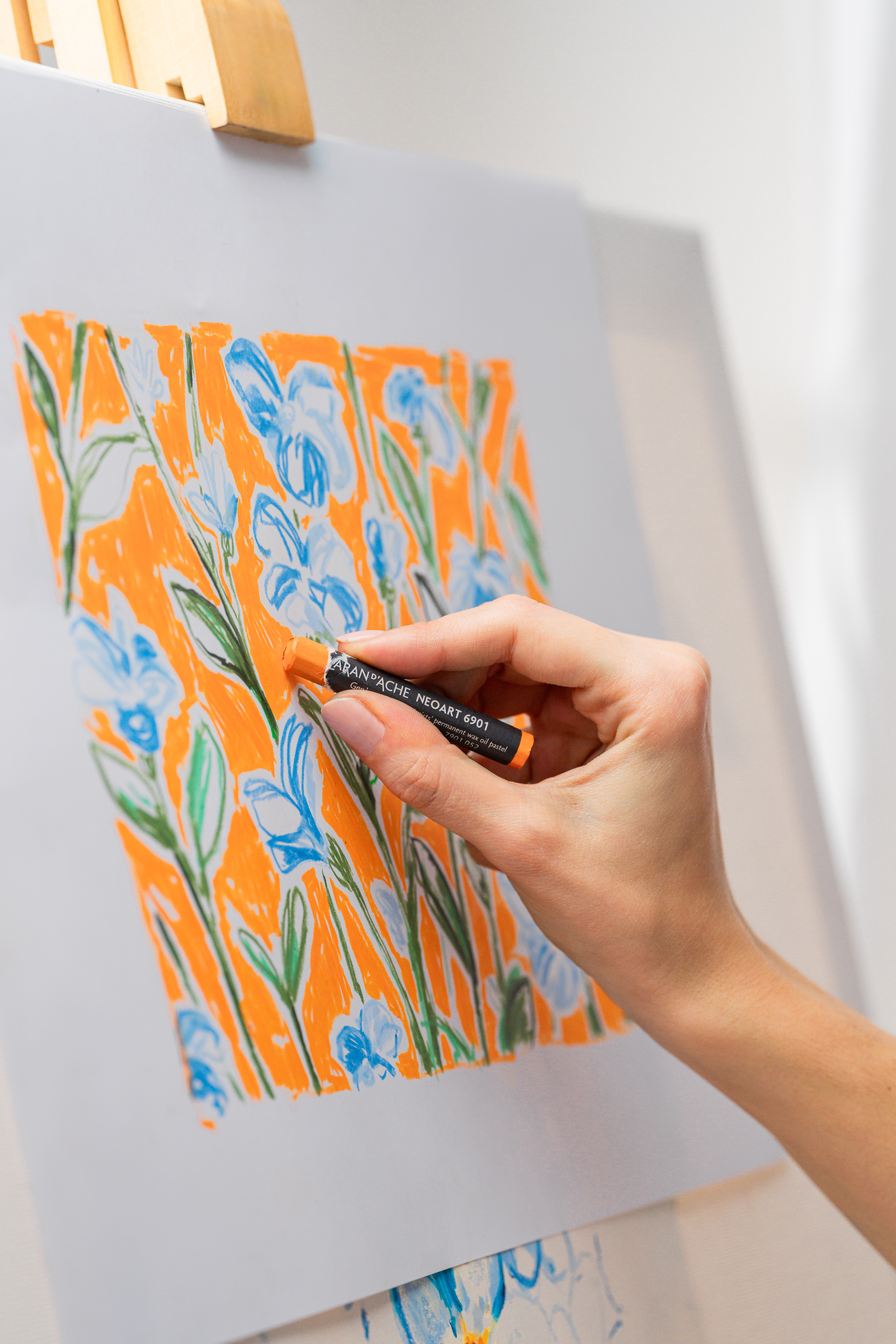 Hand drawing a floral artwork with Caran d’Ache Neoart 6901 lightfast wax oil pastel on white paper
