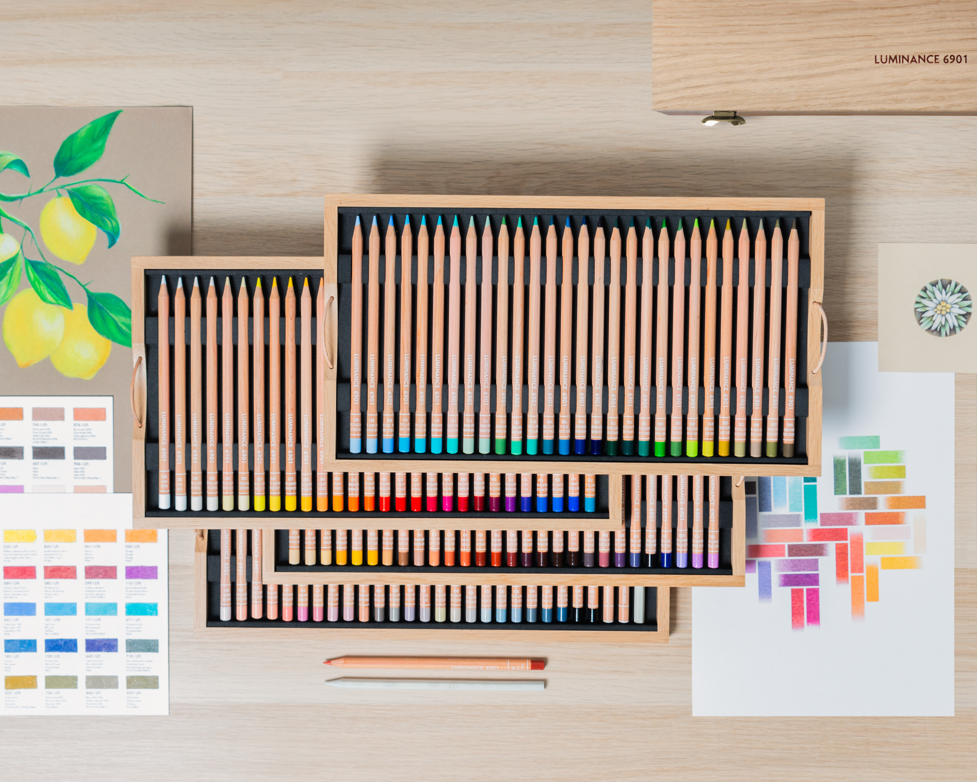 Luminance 6901 pencil set laid out in wooden trays—portrait and botanical colours in archival, lightfast cores.