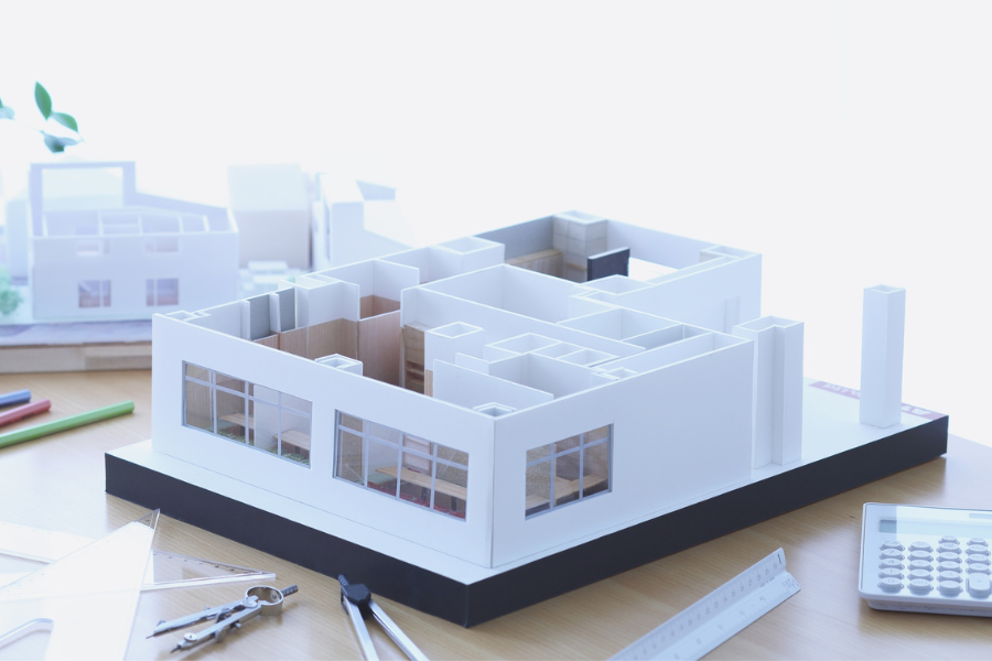 White architectural building model with tools and scale — professional model-making supplies at Kadmium Sydney Art shop
