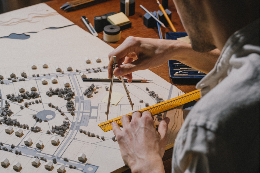 Student crafting a site model with compass and ruler — model-making supplies at Kadmium Art & Design Supplies, Sydney