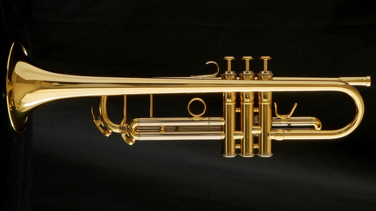 Adams Sonic professional B-flat trumpet in gold lacquer full side view