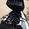 Storage bin organiser with gear packed inside the open front bin of a white Sea-Doo
