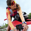 Rider smiling beside the LinQ Lite camera holder and action camera on a Spark