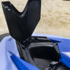 Spark Front Storage Bin lid open on a blue Sea-Doo Spark showing the storage space