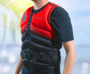 Rider wearing the Sea-Doo X-RS L50 life jacket 287013-30 in red and black, front view
