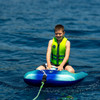Young rider in a life jacket sitting in the Jobe Shark Trainer tube on the water