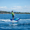 Jobe Shark Trainer being towed across open water with a young rider aboard