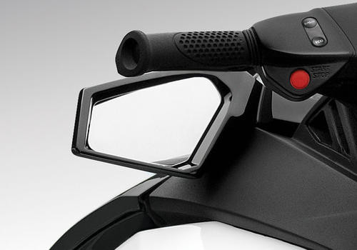 Spark side mirror fitted below the handlebar grip of a black Sea-Doo Spark