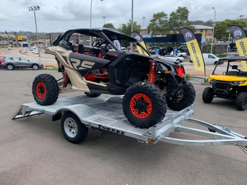 Can-Am Maverick X3 loaded on the Towrex SSV tilt trailer at an outdoor event