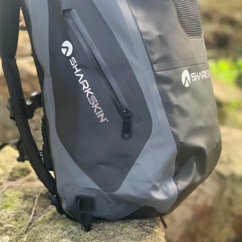 Sharkskin Performance Dry Backpack 30L in grey, close-up on a rock
