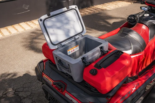 LinQ 20 L cooler open on the back of a red Sea-Doo next to a fuel caddy