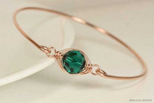 14k rose gold filled wire wrapped bangle bracelet with emerald green crystal handmade by Jessica Luu Jewelry