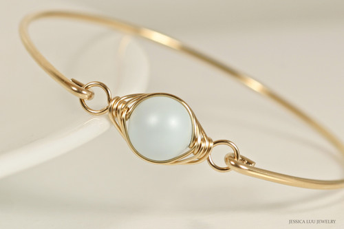 14k yellow gold filled wire wrapped bangle bracelet with pastel light blue pearl handmade by Jessica Luu Jewelry