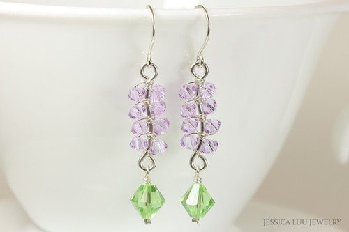 Sterling silver dangle earrings with peridot light green and lavender light purple crystals handmade by Jessica Luu Jewelry