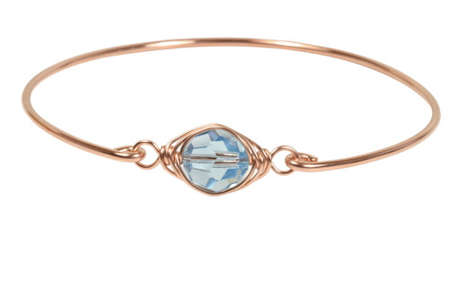 14k rose gold filled wire wrapped bangle bracelet with aquamarine blue crystal handmade by Jessica Luu Jewelry