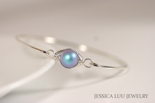 Sterling silver wire wrapped bangle bracelet with iridescent light blue pearl handmade by Jessica Luu Jewelry