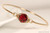 14k yellow gold filled wire wrapped bangle bracelet with scarlet red crystal handmade by Jessica Luu Jewelry