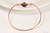 14k rose gold filled wire wrapped bangle bracelet with garnet red siam crystal handmade  by Jessica Luu Jewelry